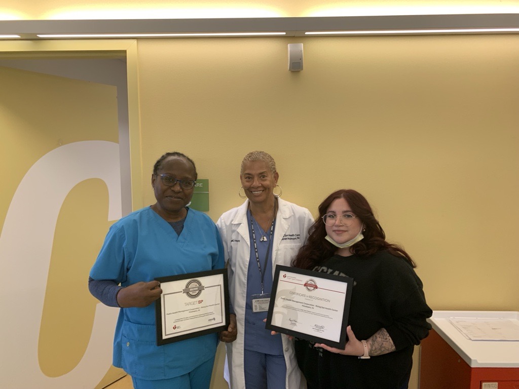 Three nurses from Rising Sun Health Center holding their certificates.